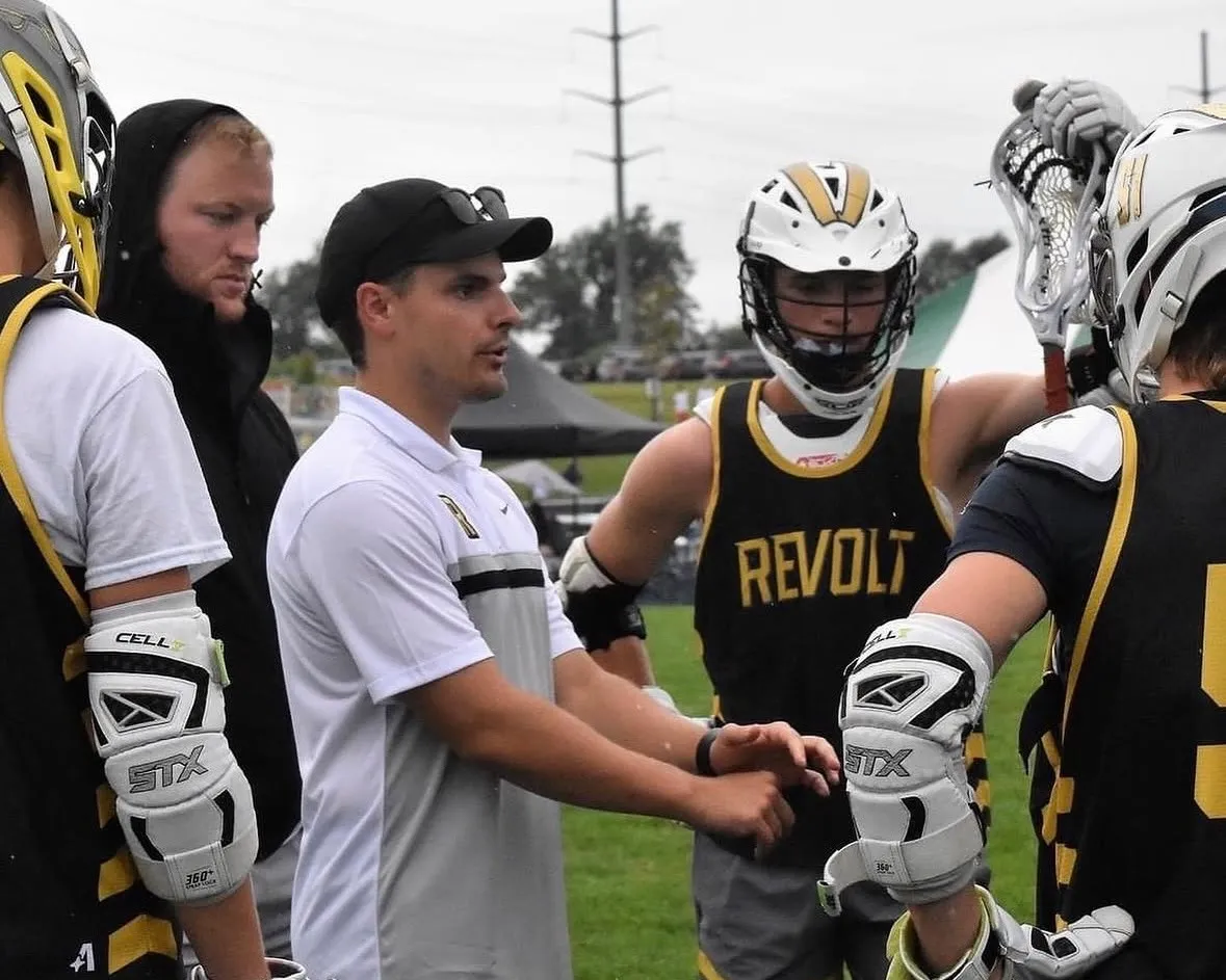 Mitchell Wilkins on the field with Revolt players in gold pinnies