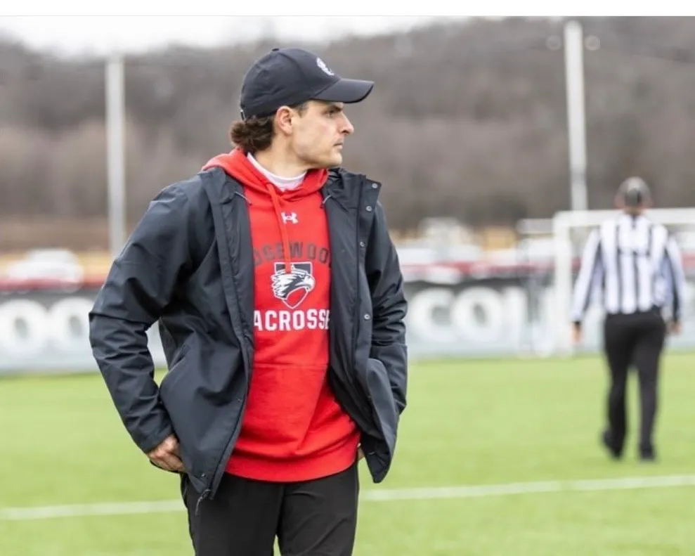 Mitchell Wilkins on the sideline in Edgewood lacrosse gear